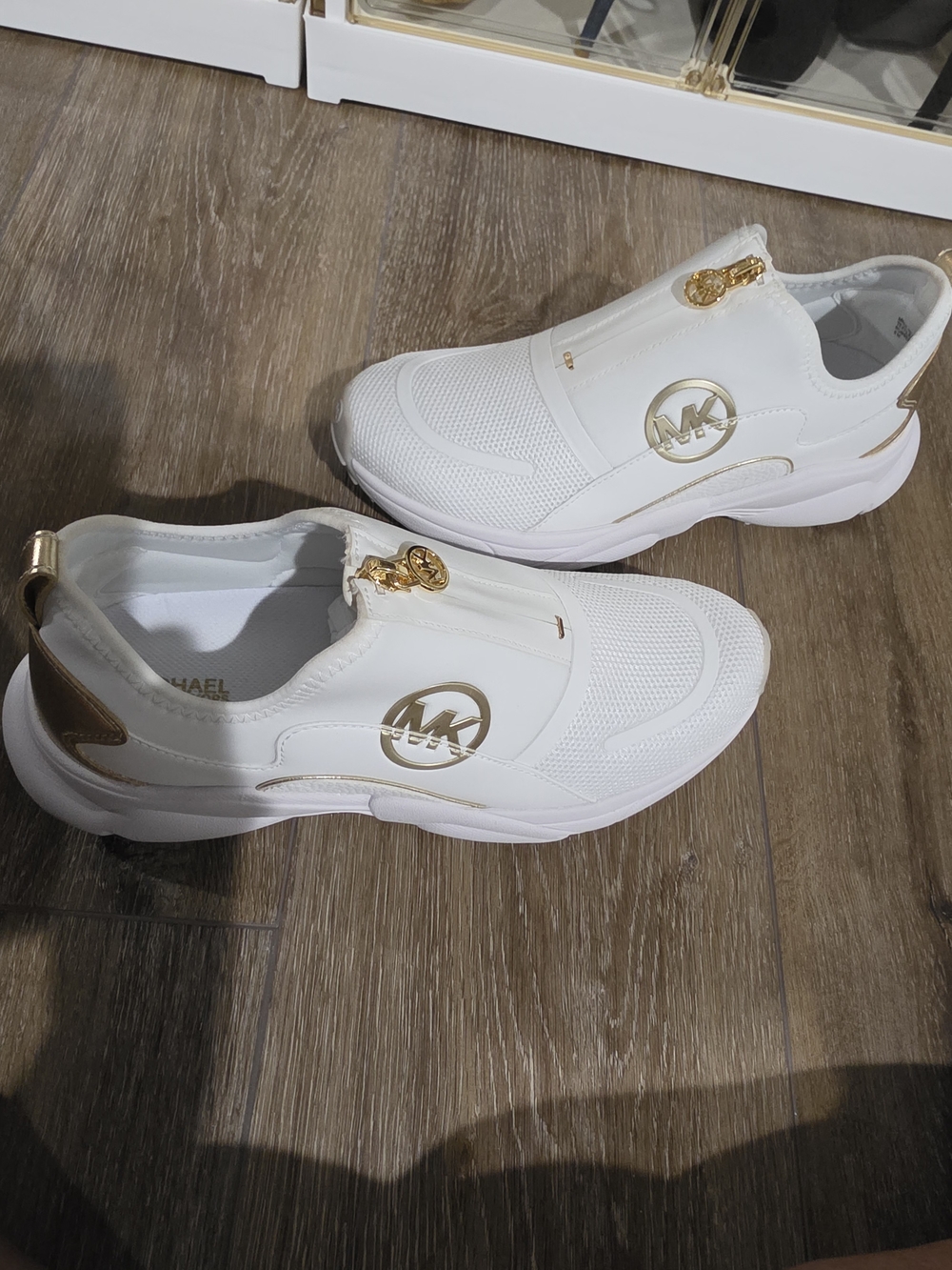 Michael Kors White Slip-On Sneakers with Gold Logo Accents
